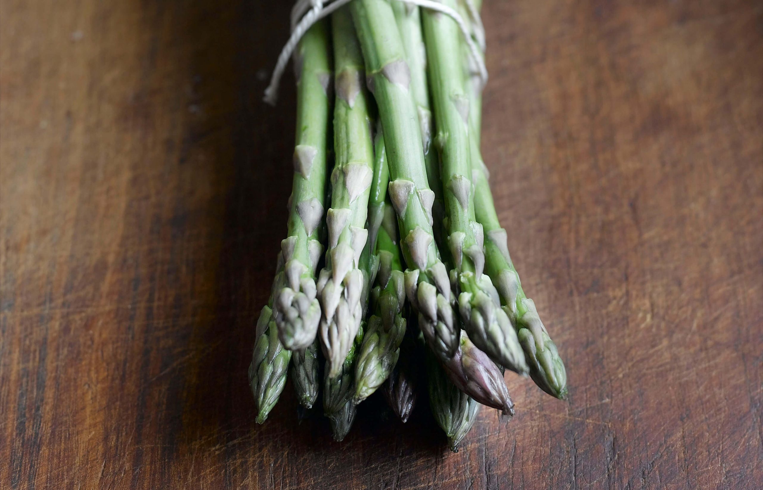 A bundle of asparagus tied with string