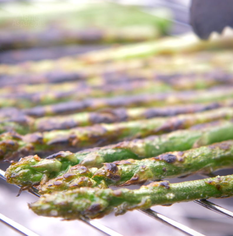 Some asparagus on a barbeque